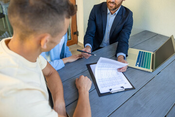 Real estate agent discussing deal details with the clients