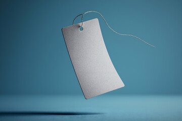 Hanging Blank Paper Tag with String on Blue Background Mockup. Mock up promotion information for marketing announcements and details, blank white space