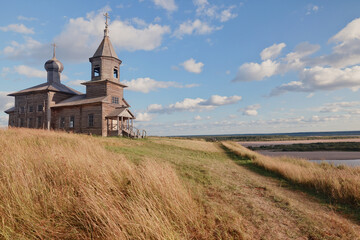 Fototapeta premium wooden church, landscape wooden architecture of the Russian north, Orthodox architecture Arkhangelsk region