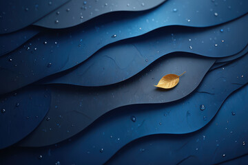 Golden leaf resting on blue layered surfaces with water droplets in a calming composition