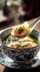 Freshly Prepared Dumpling Soup with Steam Rising and Green Garnish