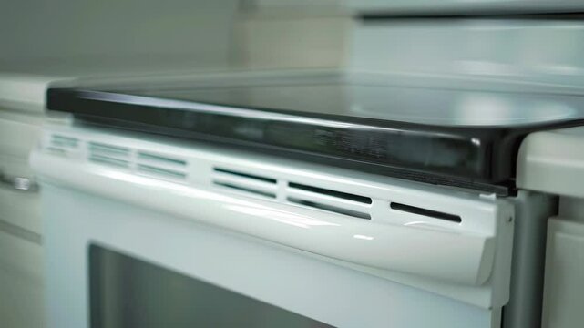 Clean white oven range in a modern kitchen, close up