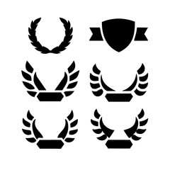 elegant laurel wreaths, shields, wings, and ribbon vector set.black-and-white vector pack of wreaths, shields, banners, and wings .Collection of six heraldic emblems with shields laurels helmet.
