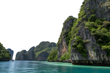 Obraz premium Emerald Isle's Serenity: Capture the tranquility of a breathtaking landscape, with towering cliffs draped in verdant foliage, as they majestically meet the placid turquoise waters.