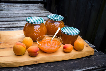 harvest of apricots - cooking homemade apricot jam and conservation in a glass