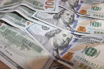 Dollars banknotes on wooden table. Top view. Business background.