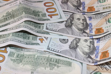 Dollars banknotes on wooden table. Top view. Business background.