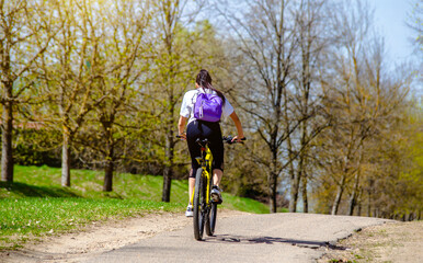 Cyclist ride on the bike path in the city Park
