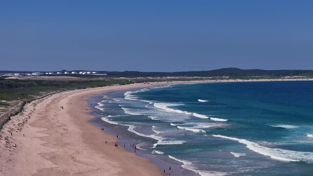 Wanda Beach, Cronulla, NSW  -UHD Video- Drone flyover view towards Kurnell - a long stretch of curved beach in the South of Sydney, Australia.