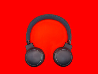 Dark green big headphones on a plain bright red background for banners, for advertising. copy space. High quality photo