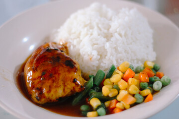Chicken teriyaki with rice and vegetables on plate