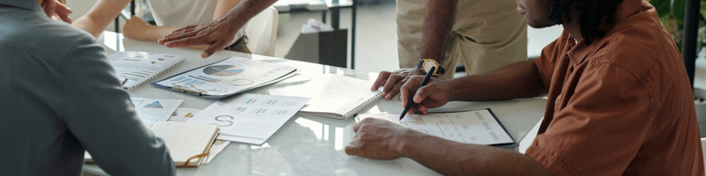 Team discussing documents at an office table