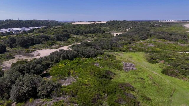 Sydney, Australia -UHD Video-Drone flyover view from Wanda Beach Reserve in Cronulla with beautiful beaches and great surf, but at the same time a sensitive environment with migrating sand dunes.