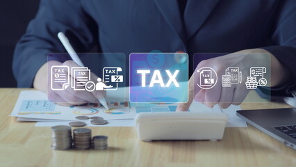 business professional using a tablet to review and calculate income tax, representing modern tax...