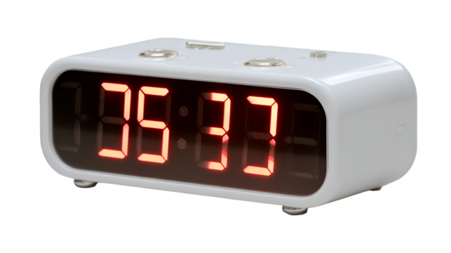 A white digital alarm clock displaying the time as five thirty seven with red led numbers on a black background