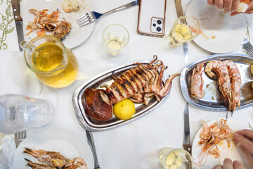The taste of the Mediterranean - fried squid with local white vine on the table