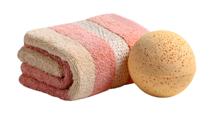 A folded pink and white striped towel with a tan bath bomb sitting next to it on a black background