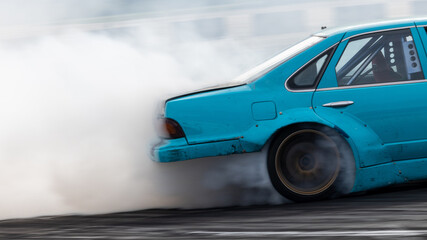 Car drifting, Blurred image diffusion race drift car with lots of smoke from burning tires on speed track, Car drifting on speed track, Professional driver drive drifting car.