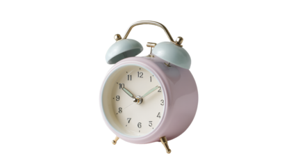 Close up of a pastel pink alarm clock with light blue bells on a black background in studio shot