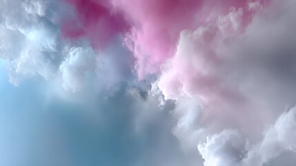 Obraz premium Pink, white and blue clouds blend, forming a soft, dreamy skyscape composition
