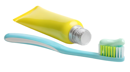 A yellow toothpaste tube with a blue toothbrush and toothpaste on the bristles close up shot isolated