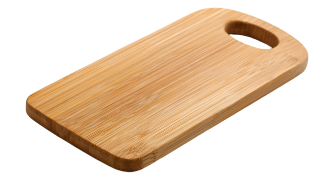 A wooden cutting board with a handle on a black background in a studio shot with soft lighting