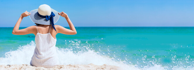 Banner back side women standing on summer beach wear summer straw hat. Cheerful asian woman...