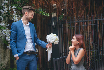 Surprise proposal young couple lover boyfriend give flower Bouquet to beautiful girlfriend to will...