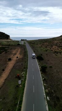 Aerial view of caravan by beach, Portugal.