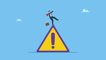 Businessman slip falling on exclamation symbol beware, careful caution sign. Symbolizes mistake caution, business risk or problem warning, failure prevention or avoid danger.