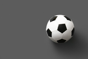 Soccer ball on grey background