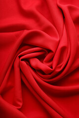 Obraz premium Closeup view of crumpled red silk fabric as background