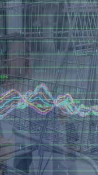 Animation of graphs over supermarket cart and caucasian businessman