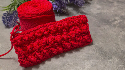 Pattern for knitting a bag. Crocheted from polyester cord. On a gray background