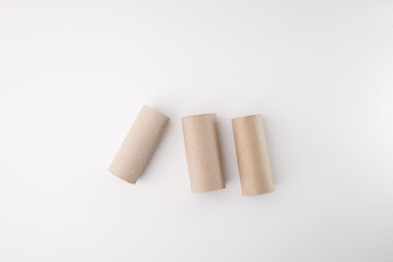 Recycled paper tubes for eco workshop or kids craft idea. Useful for educational programs, handmade branding, green product mockups or environmental awareness content