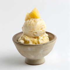 ice cream with pineapple pieces in a bowl