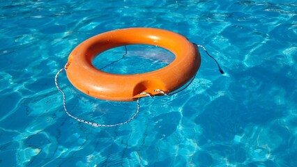 lifebouy bouy orange ring in a swimming pool