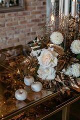 Elegant autumn bouquet with white roses and apples on glittering table