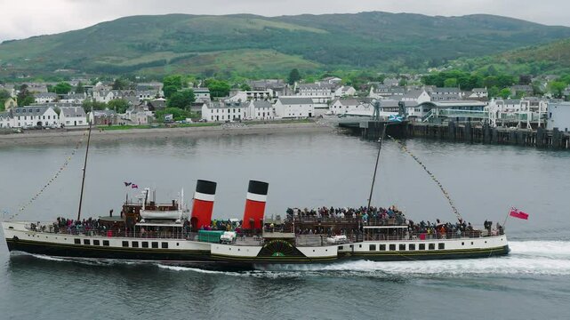Waverley departs Ullapool into rainy Loch Broom surrounded by Highland scenery and timeless maritime heritage