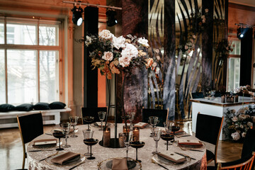 Elegant floral centerpiece adorning luxurious wedding reception table setting
