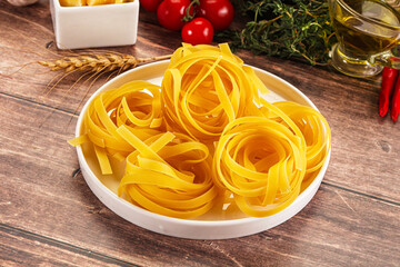 Raw dry Italian pasta - pappardelle