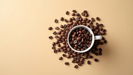 A top view of coffee beans in a white cup and scattered on a beige colored background surface flat lay