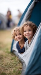 Obraz premium Two brothers are lying inside a tent at a campground, enjoying their summer travel adventure, creating cherished memories amidst nature's beauty