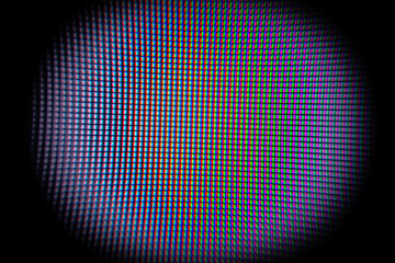 Close-up of LCD Screen Pixels, LEDs on a black background. Macro photography of a bright LED screen