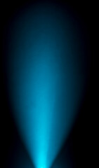 intense blue spotlight beam emanating from a central point, creating a tunnel-like effect. The...