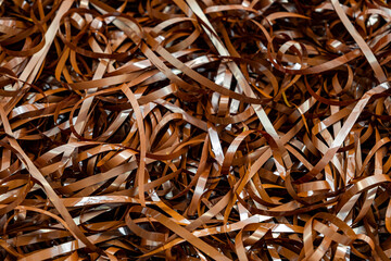 Magnetic tape unwound, magnetic audio cassette tangle, evoking nostalgia and the fragility of analog media