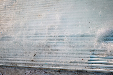 melted ice on the rink, freon pipes visible