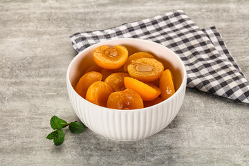 Sweet canned apricots with syrope