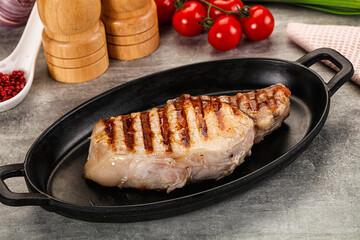 Grilled pork loin steak with bone