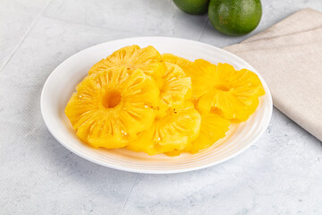 Sweet canned pineapple slices in syrope